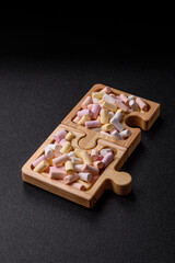 Mini marshmallows in white, pink, and pastel colors. Marshmallows as a food background