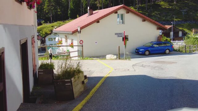 Driving around the swiss alps in the village schmitten on a sunny day in summer