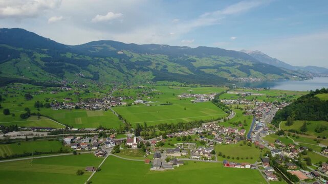 Aerial view around the city Giswil beside the the lake Sarnen in Switzerland on a sunny day in summer. 