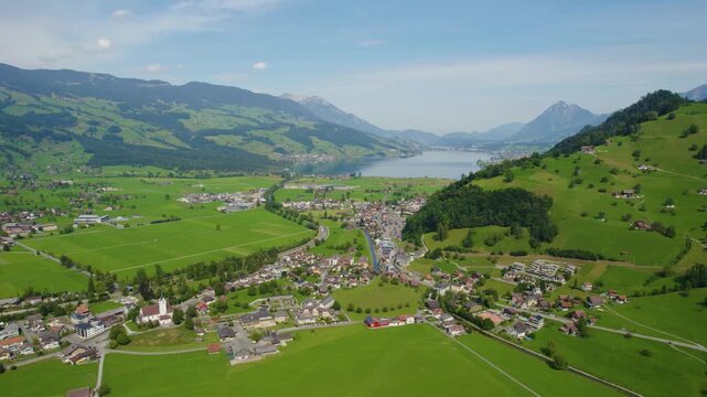 Aerial view around the city Giswil beside the the lake Sarnen in Switzerland on a sunny day in summer. 