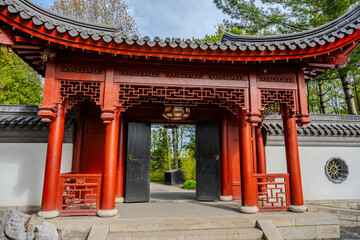 Fototapeta premium Traditional Chinese garden gate with red wooden columns