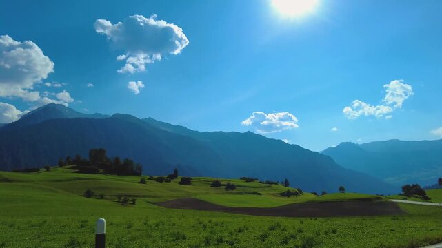 Driving around the swiss alps in the village schmitten on a sunny day in summer
