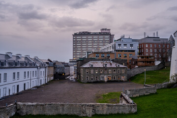 Obraz premium Historic stone buildings and modern architecture in Old Quebec City