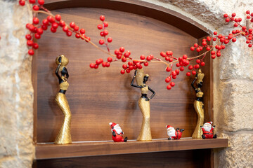 Nazareth, Israel, December 24, 2025, Christmas decorations featuring golden figurines of African...