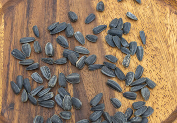 Sunflower Seeds Scattered on Rustic Wooden Background Top View