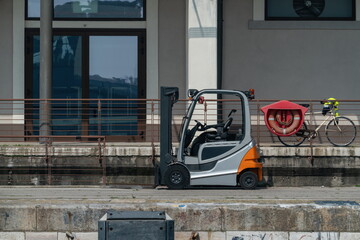 Forklift parked on harbor quay Venice, Italy