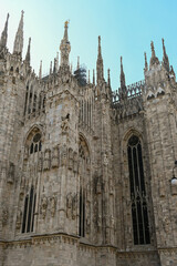 Fototapeta premium Views of central part of Milan, Brera district, shopping area, church Duomo, architectural details, streets, walking in Milan, Lombardy, Italy
