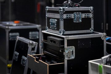 Fototapeta premium Stacked professional flight cases with aluminum corners and recessed handles for transport
