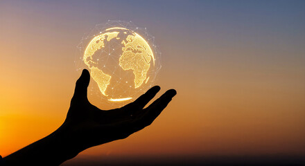 A silhouette of a hand holding a glowing, networked globe 