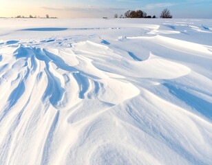 Serene winter landscape with snowdrifts and distant trees under a blue sky