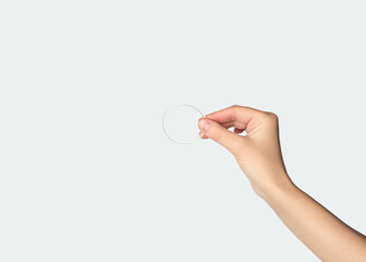 Woman's hand holding a contraceptive vaginal ring