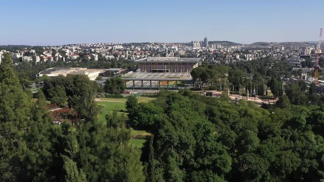 Aerial View of the Knesset, Jerusalem
Aerial drone view showing the Knesset building surrounded by greenery with Jerusalem neighborhoods in the background, Israel, November 2025.

