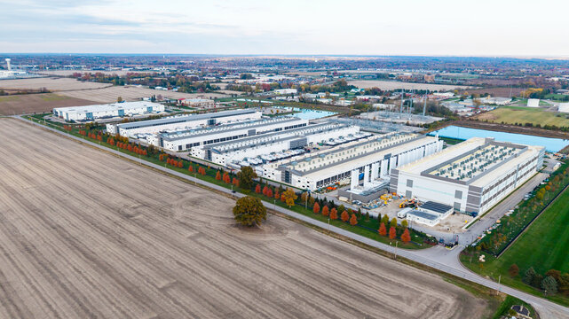 Aerial view of construction of new AI hub and Data center near Dublin Ohio in the fields. - Powered by Adobe
