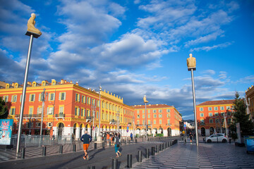 Nice, France - December - 26 - 2025: public square in the historic center with the old building of Nice colored in a sunny morning