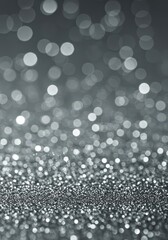 Abstract background of glowing silver bokeh lights creating a sparkling, ethereal winter wonderland scene perfect for holiday greeting cards, sparkle, Christmas, cold