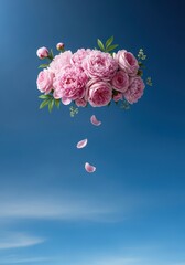Soft vintage floral arrangement of pink peonies and roses floating under a dramatic blue sky, perfect celebration background, nostalgic, decorative, floral