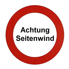 Rundes Schild mit rotem Rand und der Aufschrift "Achtung Seitenwind"