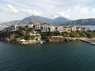 Fototapeta premium Aerial view of seaside houses in Fethiye, Turkey on sunny day
