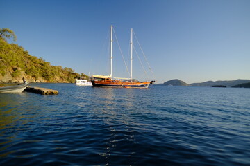 Fototapeta premium Scenic view of Göcek, a picturesque coastal town on the Turkish Riviera which known for its modern marinas, luxury yachts, and surrounding islands and bays in Fethiye, Turkey.
