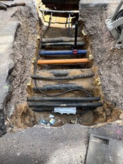 Gas and water lines under a road