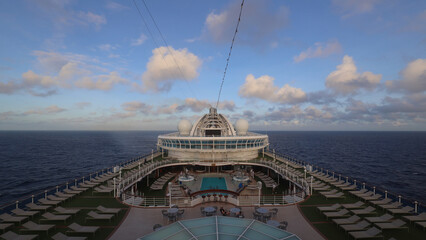 Panorama of cruise ship deck and morning clouds