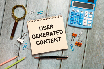 Wooden blocks with words 'USER GENERATED CONTENT'. Business concept.