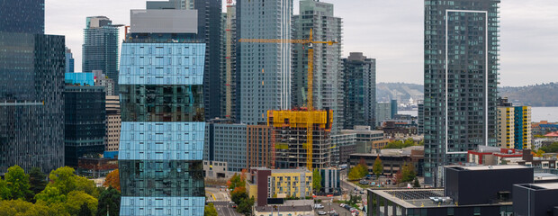 Panoramic view of modern architecture of tall glass buildings in downtown Seattle.