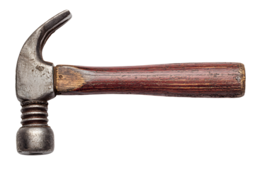 Rusty hammer resting on wooden surface with worn handle and metal head