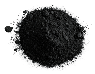 Pile of dark, granular material on a black backdrop