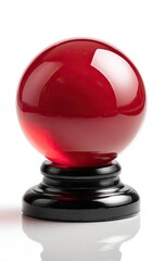 Red glass sphere on a dark pedestal