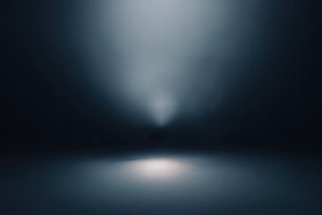 Light beams into a dark, blurry room, reflecting softly on the floor