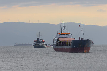 Boats and ships on the Bosphorus near Istanbul, T&uuml;rkiye, under varied light and weather, showing maritime traffic, coastal scenery, and everyday transportation.