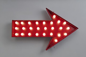 Lit red arrow sign with many bulbs pointing right, on a neutral wall