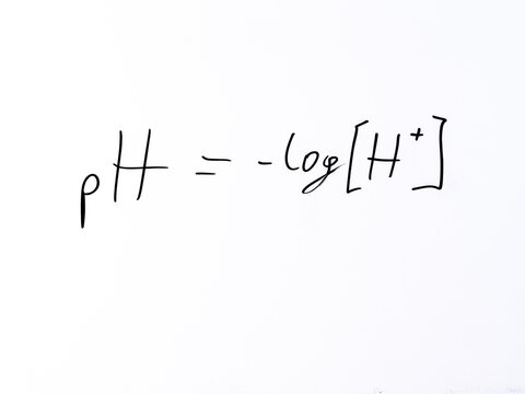 Minimal handwritten formula &ldquo;pH = &ndash;log[H⁺]&rdquo; defining the pH scale as the negative logarithm of hydrogen ion concentration.