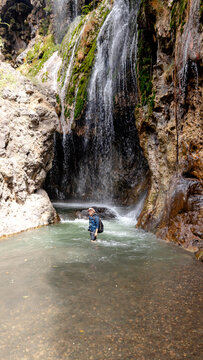 Engare Sero Waterfall in Tanzania with hiker enjoying nature