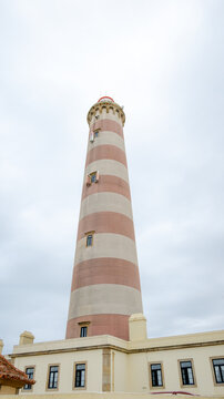 Farol da Barra standing tall against the cloudy sky