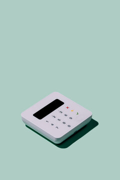 Minimalist POS terminal on a mint green background