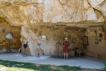 Woman Praying in Cave Chapel at Basarbovo