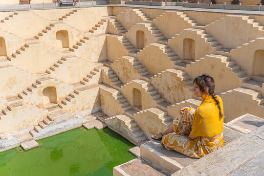 Woman in traditional attire at Indian stepwell temple