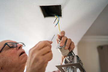 Active senior enjoying DIY project in kitchen renovation