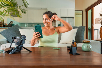 Content creator filming a skincare tutorial at home