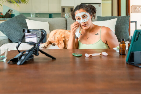 Content creator filming skincare routine at home