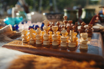 Vintage wooden chess board with medieval pieces