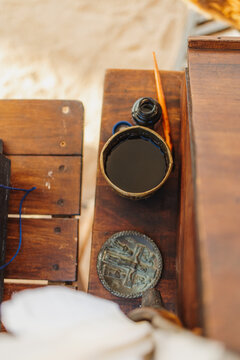 Vintage medieval writing desk with quill pen and ink
