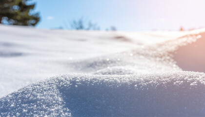 Close-up of sparkling snow surface in winter sunlight, clean natural texture background