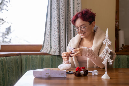 Young woman engaged in crafting at home