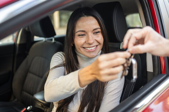 Woman receiving car keys for an exciting road trip