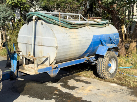 Tanker truck attached to a tractor in rural setting