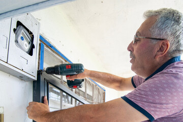 Man using cordless drill for home repair