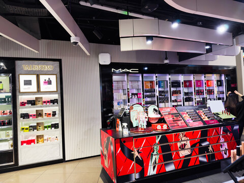 Cosmetics store interior with MAC makeup counter and Valentino display in Manchester UK